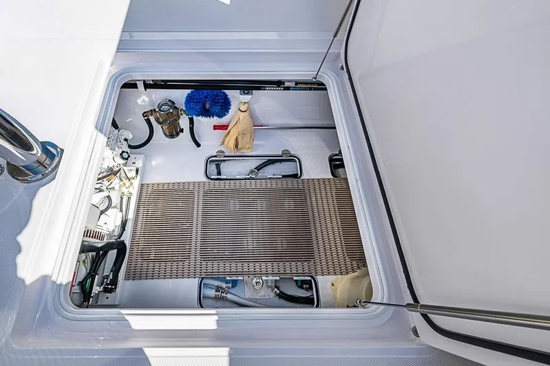  Yacht Photos Pics Open hatch of 2025 Sparks 46 boat showing storage and equipment.