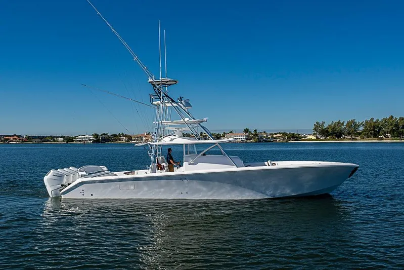  Yacht Photos Pics A sleek 2025 Sparks 46 yacht cruising on a calm, sunny day.