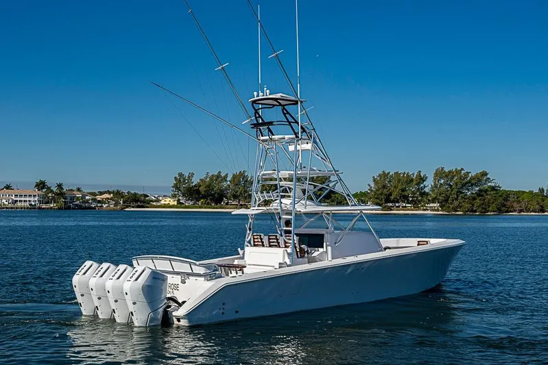 Yacht Photos Pics 2025 Sparks 46 boat with multiple engines cruising on a sunny day.