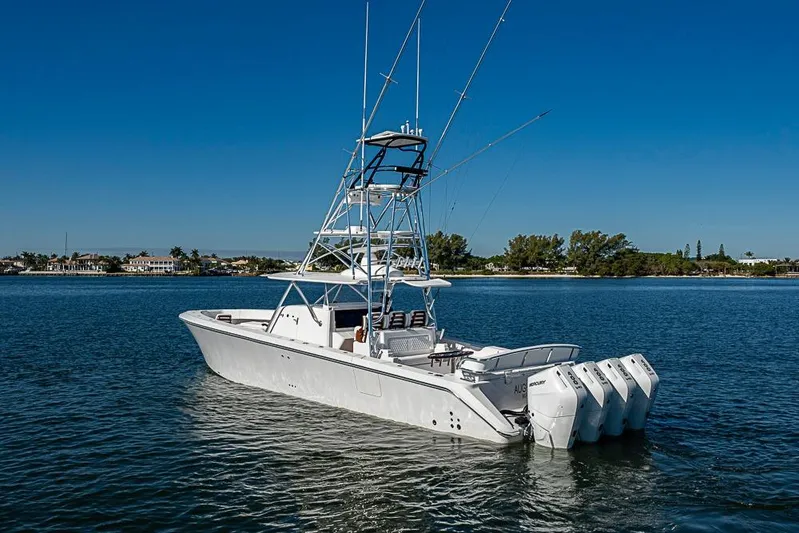  Yacht Photos Pics Luxury Sparks 46 boat, 2025 model, with multiple engines on calm water.