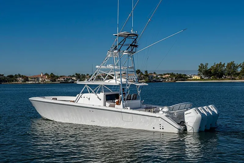  Yacht Photos Pics A 2025 Sparks 46 boat with multiple outboard engines on a calm waterway.