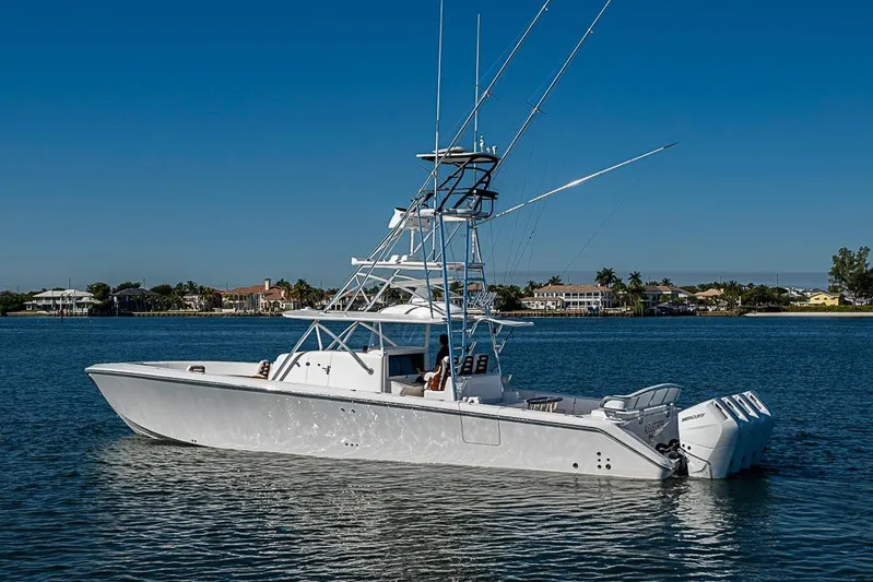  Yacht Photos Pics Sparks 46 boat, 2025 model, cruising on calm waters under clear blue sky.