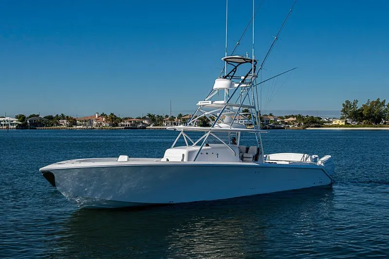  Yacht Photos Pics Sparks 46 boat, 2025 model, cruising on calm waters under clear blue sky.