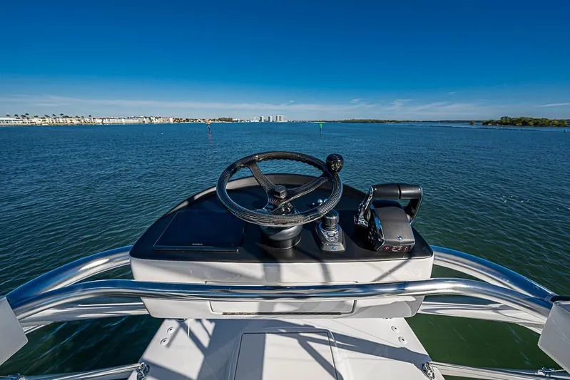  Yacht Photos Pics Helm of Sparks 46 boat, 2025 model, overlooking serene blue waters.