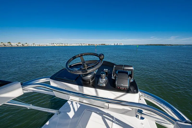  Yacht Photos Pics Helm of Sparks 46 boat, 2025 model, overlooking calm blue waters.