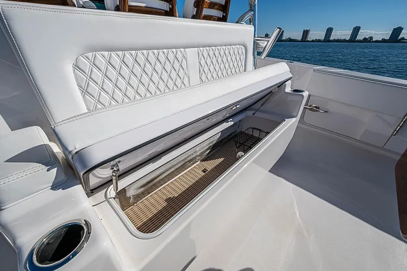  Yacht Photos Pics Luxury seating on Sparks 46 yacht, 2025 model, with storage compartment open, ocean view.