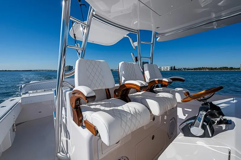  Yacht Photos Pics Luxurious 2025 Sparks 46 boat interior with plush seating and sleek design on open water.