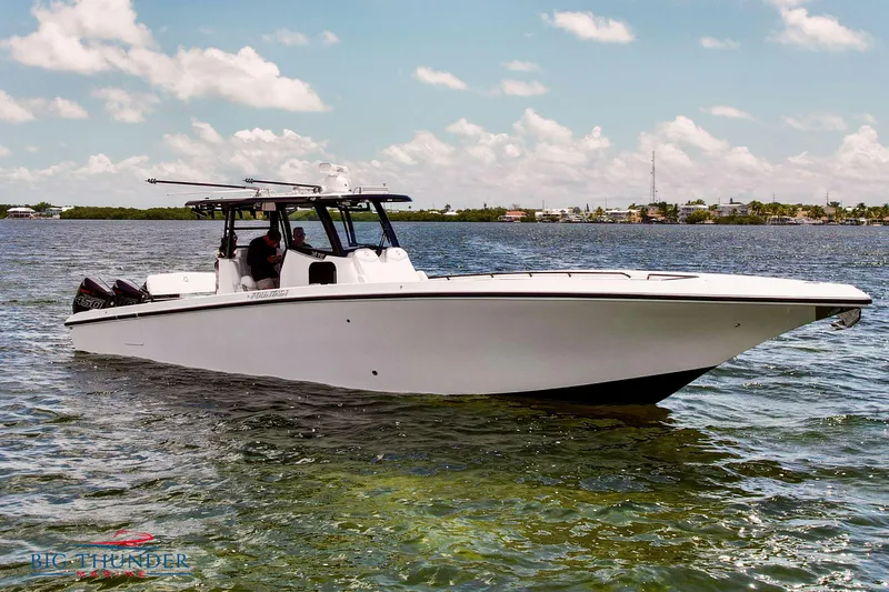  Yacht Photos Pics 2023 Fountain 38 TE boat cruising on a sunny day.