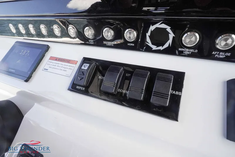  Yacht Photos Pics Control panel of a 2023 Fountain 38 TE boat with switches and display.