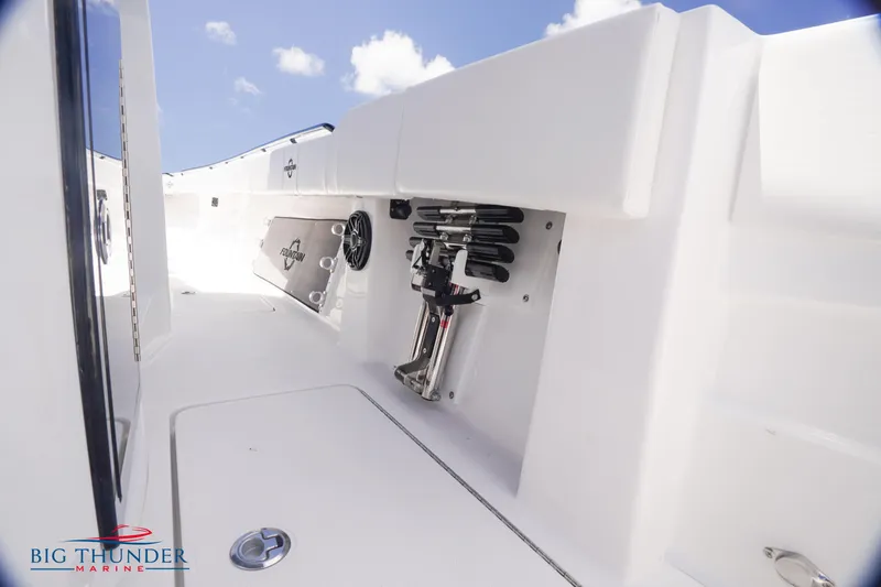  Yacht Photos Pics 2023 Fountain 38 TE boat interior with storage compartments and Big Thunder Marine logo.