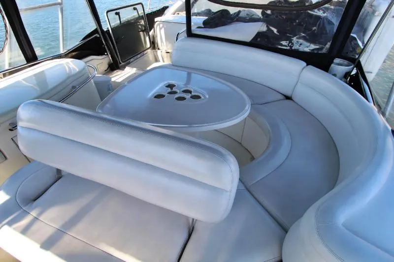 Yacht Photos Pics Luxurious seating area on a 1999 Azimut 58 yacht with elegant white upholstery.