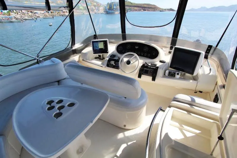  Yacht Photos Pics Cockpit of 1999 Azimut 58 yacht with modern navigation equipment and ocean view.