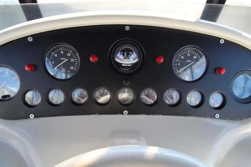  Yacht Photos Pics Control panel of a 1999 Azimut 58 yacht with gauges and indicators.
