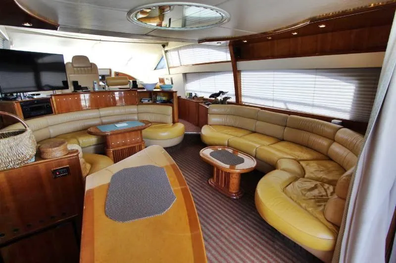  Yacht Photos Pics Luxurious interior of a 1999 Azimut 58 yacht with elegant seating and modern amenities.