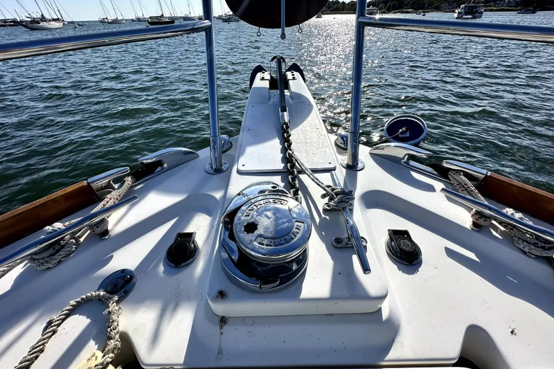 Destiny Yacht Photos Pics Bow view of 2007 Sabre 34 Express yacht with anchor chain and ocean backdrop.