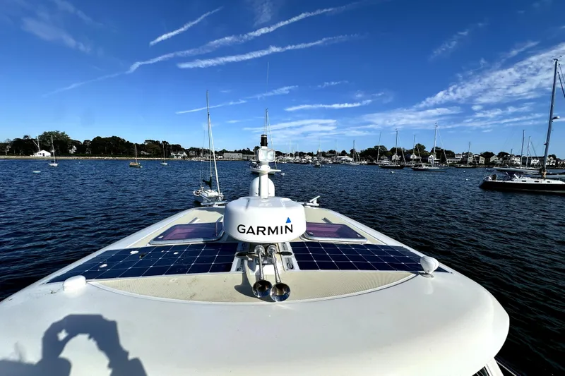 Destiny Yacht Photos Pics 2007 Sabre 34 Express boat with Garmin equipment, docked in a scenic marina.