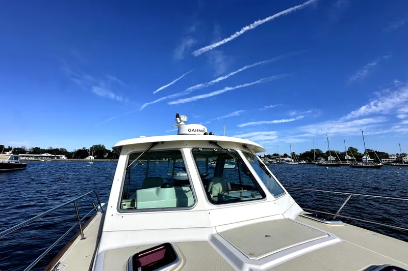 Destiny Yacht Photos Pics 2007 Sabre 34 Express boat on water under clear blue sky.