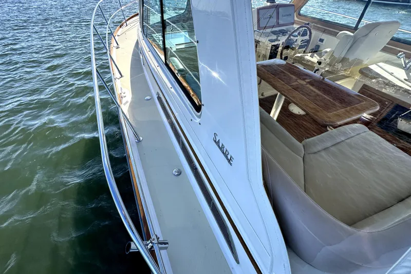 Destiny Yacht Photos Pics 2007 Sabre 34 Express yacht with sleek design and luxurious interior on water.