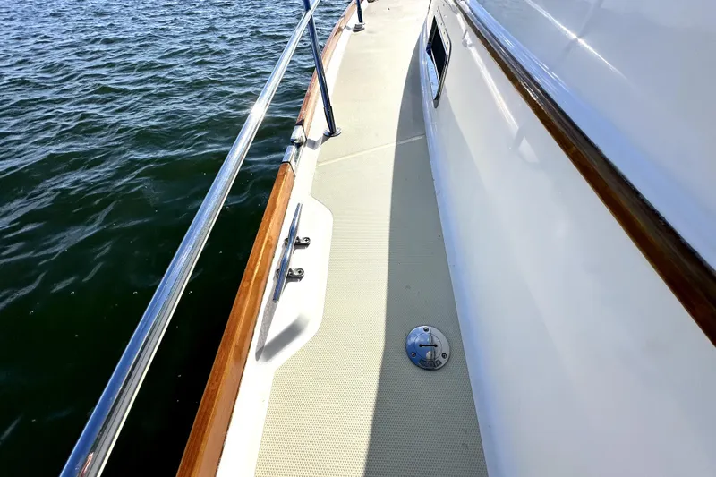 Destiny Yacht Photos Pics 2007 Sabre 34 Express yacht deck with polished railings and water view.