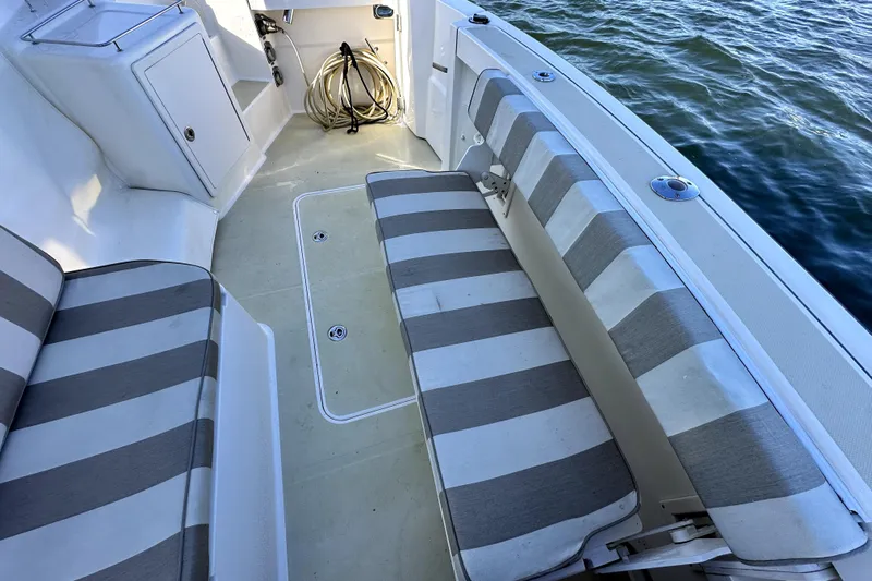 Destiny Yacht Photos Pics 2007 Sabre 34 Express boat interior with striped seating and water view.