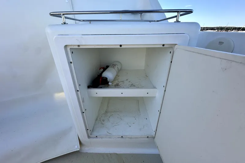 Destiny Yacht Photos Pics Open storage compartment on 2007 Sabre 34 Express boat with fire extinguisher inside.