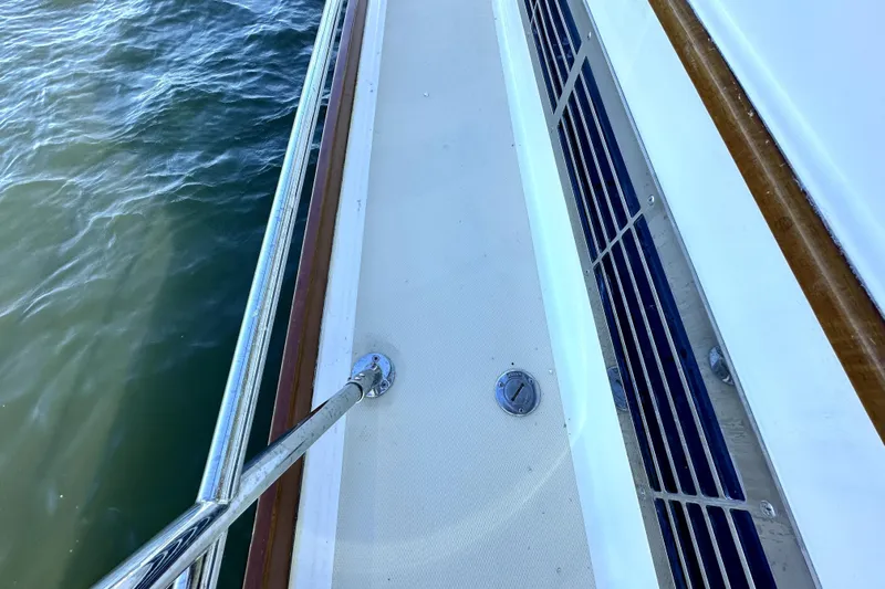 Destiny Yacht Photos Pics Deck view of 2007 Sabre 34 Express yacht with railing and water.