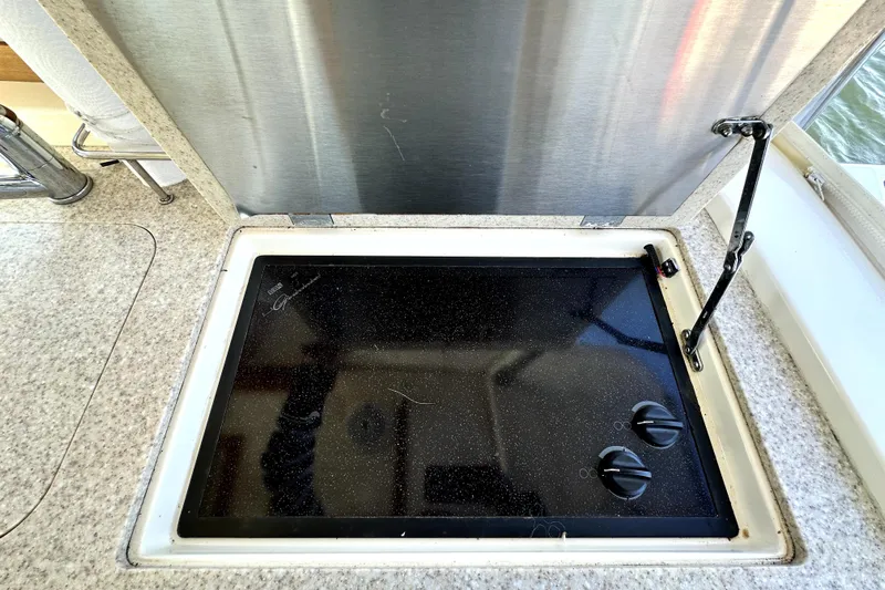 Destiny Yacht Photos Pics Built-in stovetop on 2007 Sabre 34 Express yacht, featuring two control knobs.