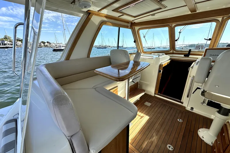 Destiny Yacht Photos Pics Interior of 2007 Sabre 34 Express boat with wooden flooring and seating area.