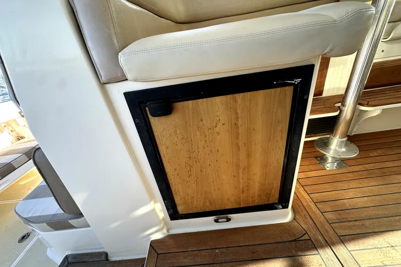 Destiny Yacht Photos Pics 2007 Sabre 34 Express interior with wooden cabinet and cushioned seating.
