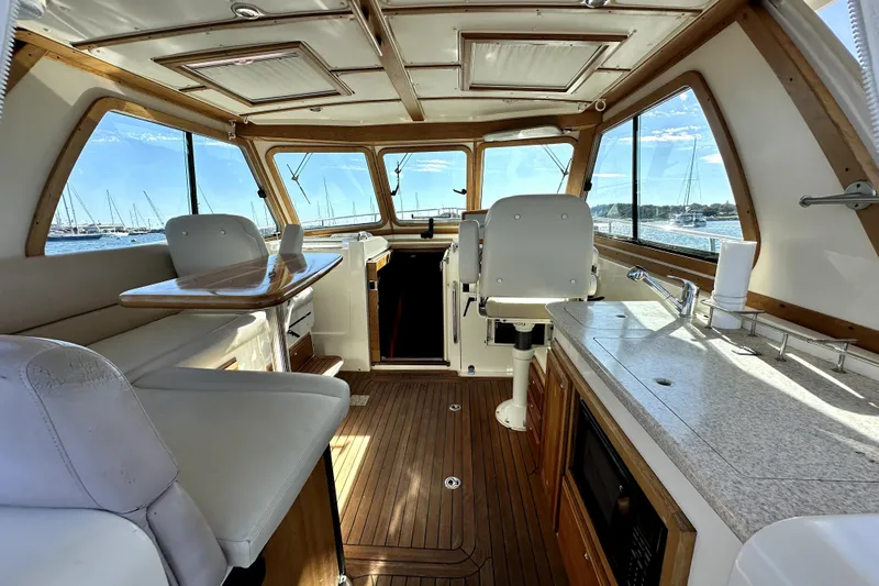 Destiny Yacht Photos Pics Interior of 2007 Sabre 34 Express yacht with wood accents and panoramic windows.