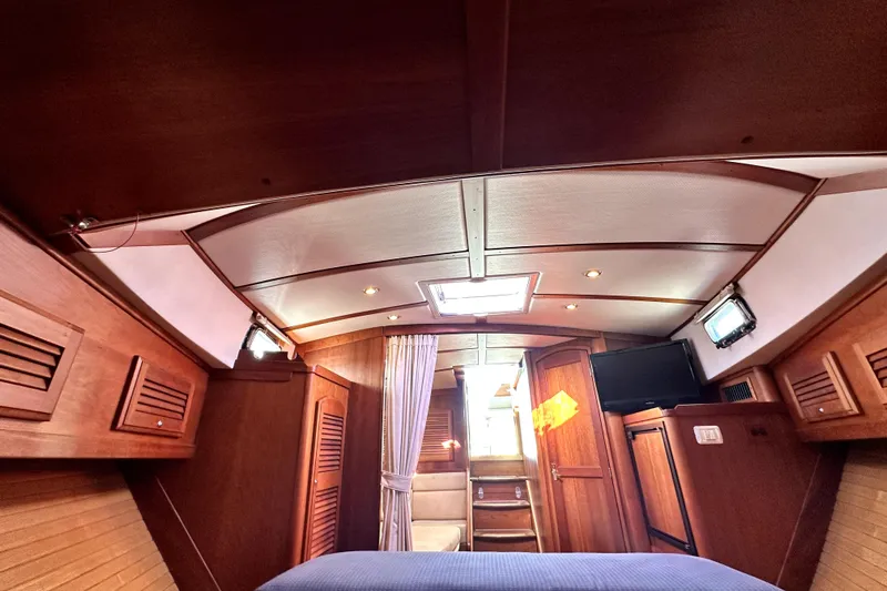 Destiny Yacht Photos Pics Interior of 2007 Sabre 34 Express yacht, featuring wood paneling and cozy cabin design.