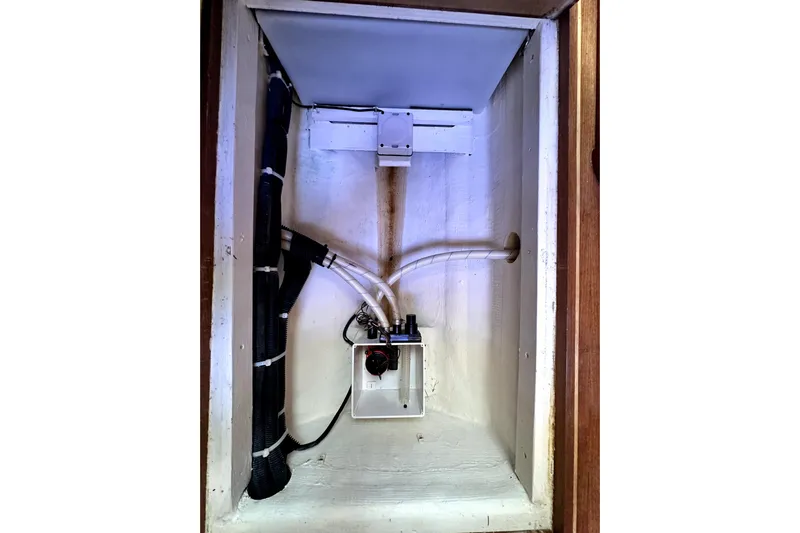 Destiny Yacht Photos Pics 2007 Sabre 34 Express interior compartment with wiring and tubing.