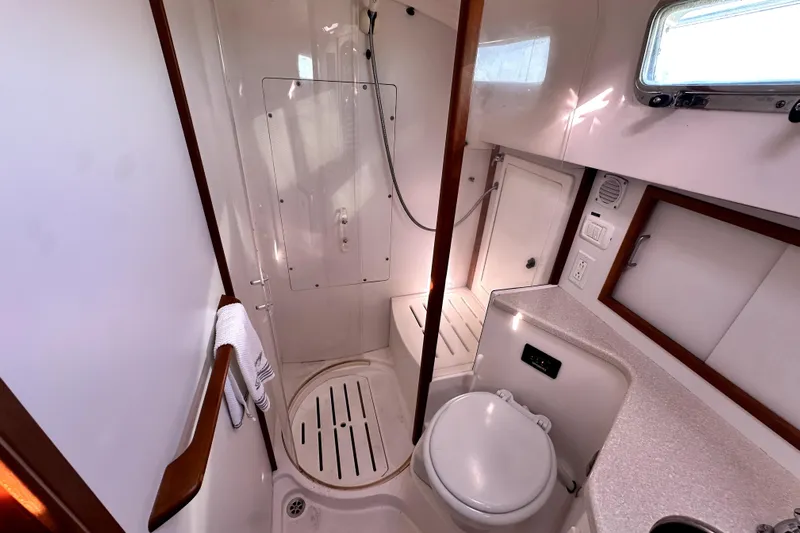Destiny Yacht Photos Pics 2007 Sabre 34 Express yacht bathroom with shower, toilet, and countertop.