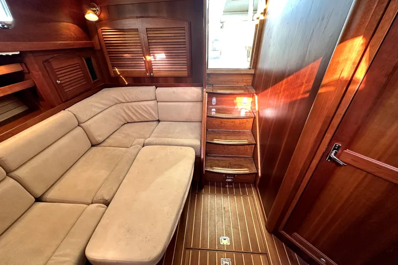 Destiny Yacht Photos Pics Luxurious interior of 2007 Sabre 34 Express yacht with beige seating and wooden finishes.