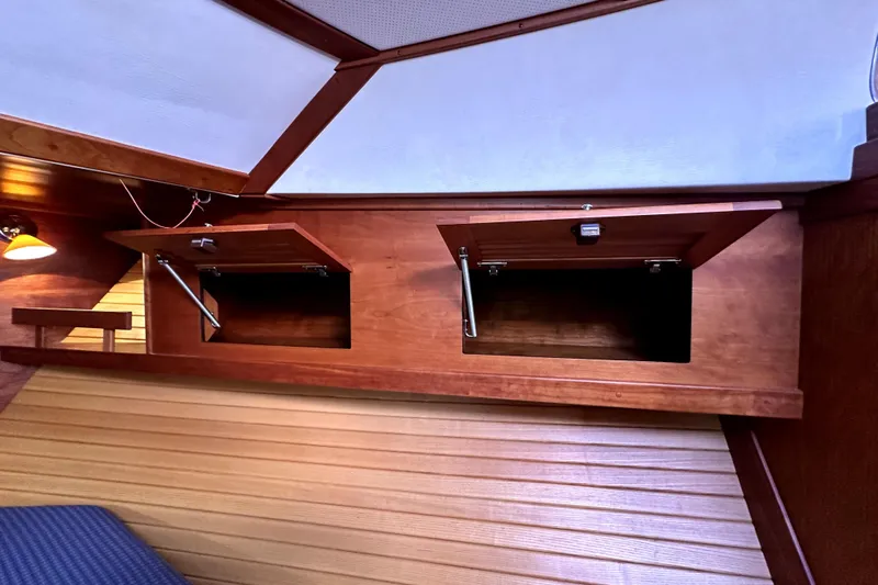 Destiny Yacht Photos Pics 2007 Sabre 34 Express interior with open wooden storage compartments.