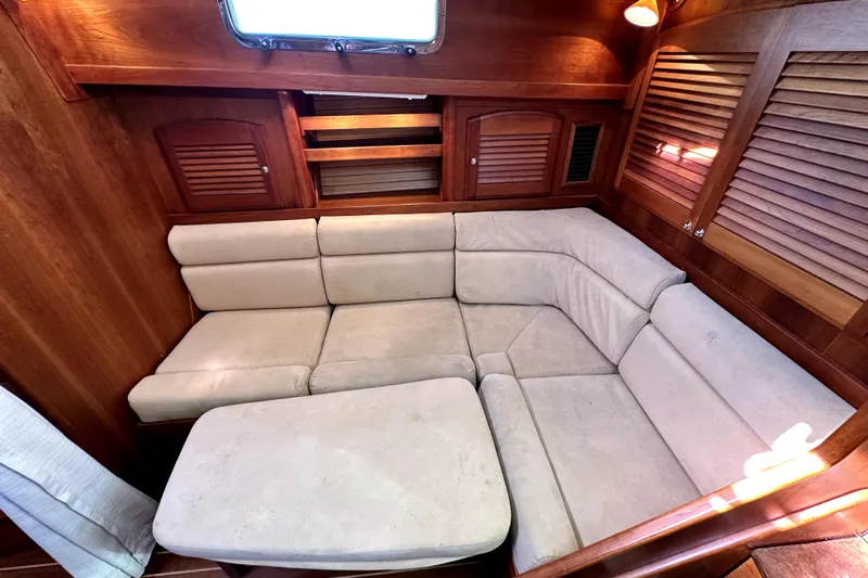 Destiny Yacht Photos Pics Luxurious interior of 2007 Sabre 34 Express yacht with beige seating and wooden accents.