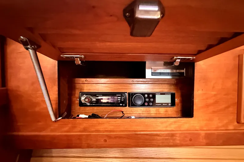 Destiny Yacht Photos Pics 2007 Sabre 34 Express interior cabinet with audio system and wooden finish.