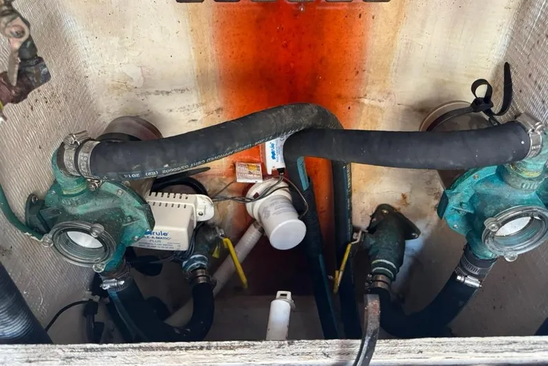 Destiny Yacht Photos Pics Engine compartment of a 2007 Sabre 34 Express with visible hoses and components.