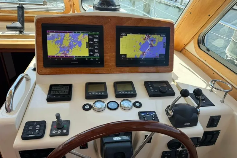 Destiny Yacht Photos Pics Dashboard of 2007 Sabre 34 Express boat with navigation screens and controls.
