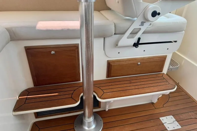 Destiny Yacht Photos Pics 2007 Sabre 34 Express interior with wooden steps and cushioned seating.