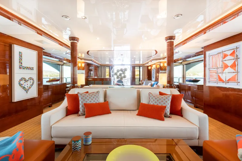 Checkmate Yacht Photos Pics Luxurious interior of 2013 Benetti 44 yacht with elegant decor and vibrant cushions.
