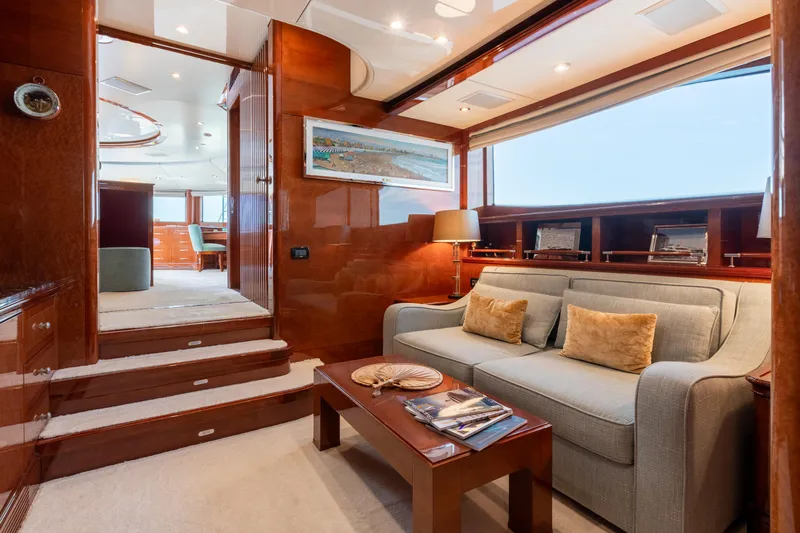 Checkmate Yacht Photos Pics Luxurious interior of 2013 Benetti 44 yacht with elegant seating and wooden finishes.