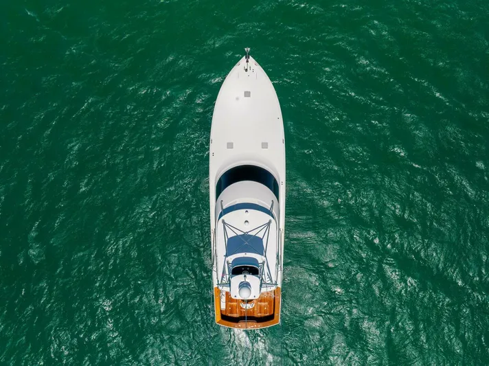 Mighty Mouse Yacht Photos Pics Aerial view of 2011 Viking 70 Convertible yacht on vibrant green water.