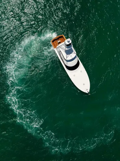 Mighty Mouse Yacht Photos Pics Aerial view of 2011 Viking 70 Convertible yacht navigating in green ocean waters.
