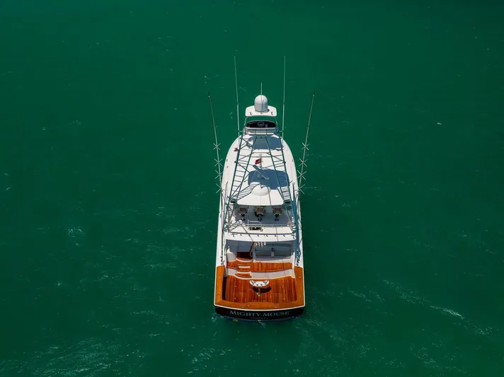 Mighty Mouse Yacht Photos Pics Aerial view of 2011 Viking 70 Convertible yacht on turquoise water.