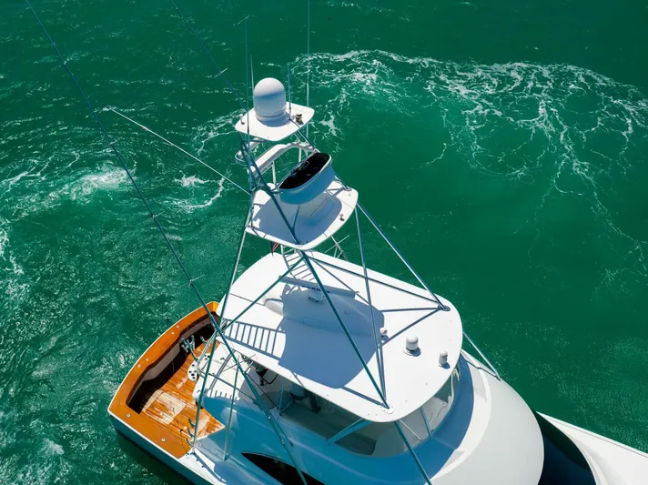 Mighty Mouse Yacht Photos Pics Aerial view of 2011 Viking 70 Convertible yacht on turquoise water.