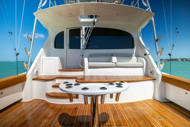 Mighty Mouse Yacht Photos Pics Luxurious 2011 Viking 70 Convertible yacht deck with seating and fishing rod holders.