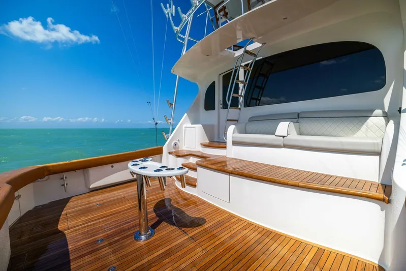 Mighty Mouse Yacht Photos Pics Luxurious 2011 Viking 70 Convertible yacht deck with wooden flooring and ocean view.