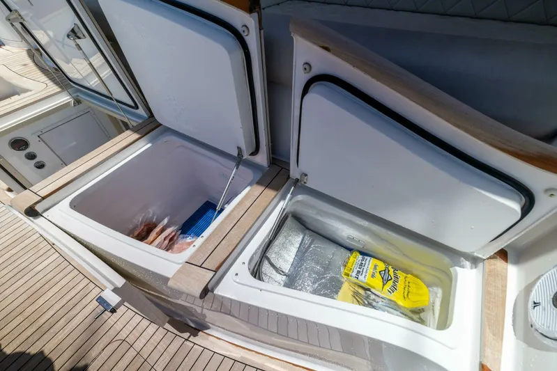 Mighty Mouse Yacht Photos Pics Open storage compartments on 2011 Viking 70 Convertible yacht deck.