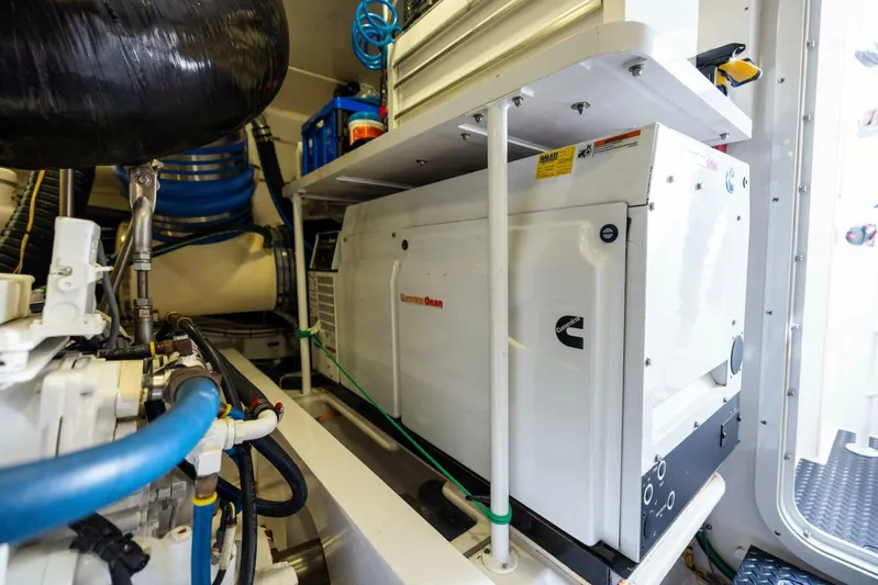 Mighty Mouse Yacht Photos Pics Engine room of 2011 Viking 70 Convertible yacht with Cummins generator and piping.